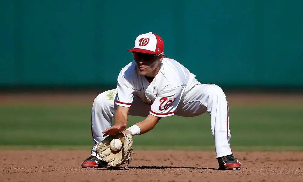 catching ball with baseball sunglasses on